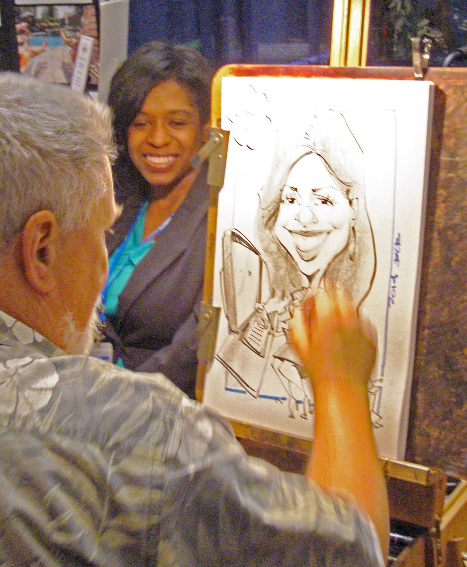 A man is drawing a picture of a woman on an easel