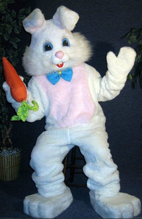 A white bunny mascot is holding a carrot