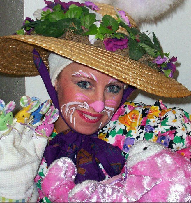 A woman wearing a straw hat with flowers on it