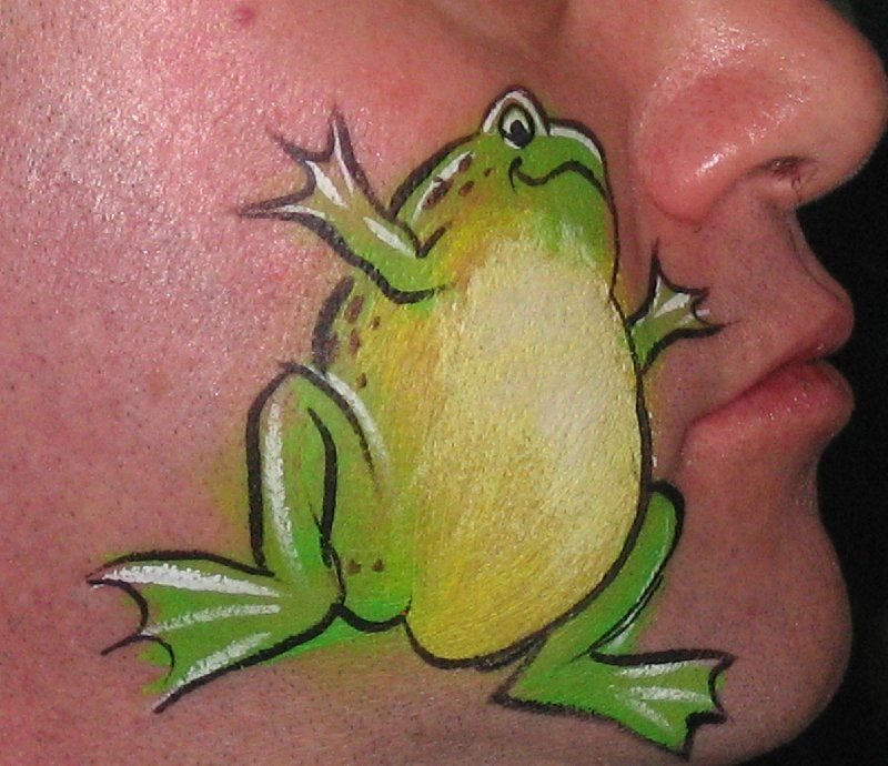 A man has a frog painted on his face