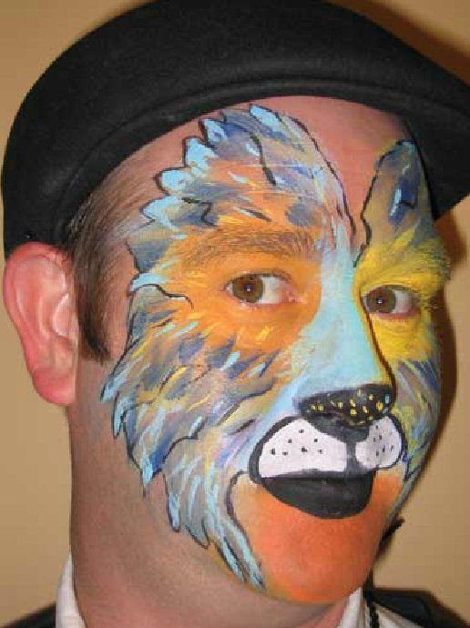 A man with his face painted like a lion
