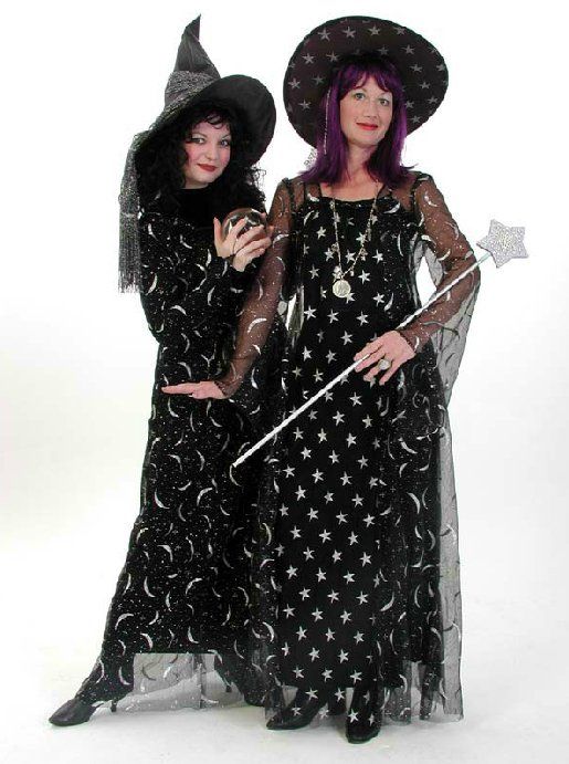 Two women dressed as witches are standing next to each other