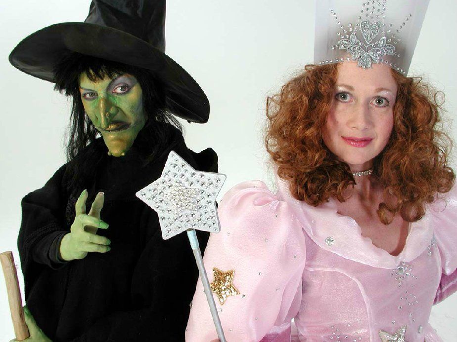 A witch and a fairy are standing next to each other