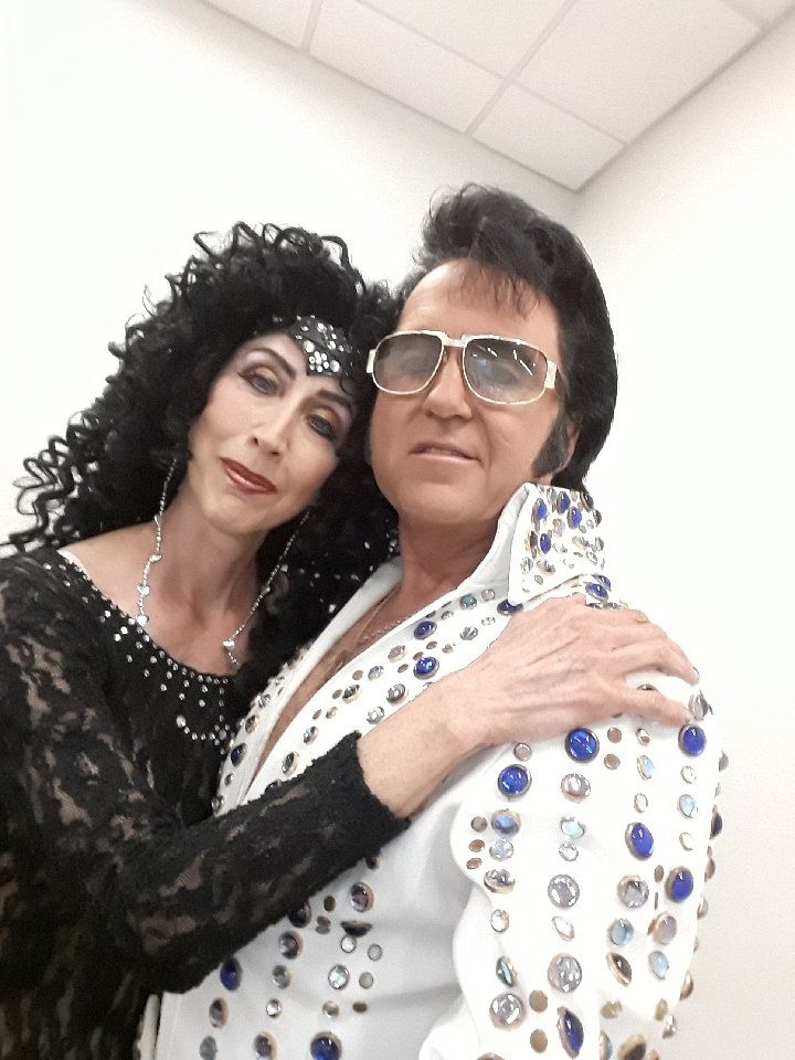 A man and a woman are posing for a picture together