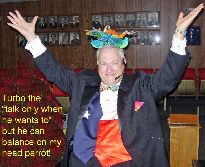 A man in a tuxedo with his arms in the air says turbo the talk only when he wants to