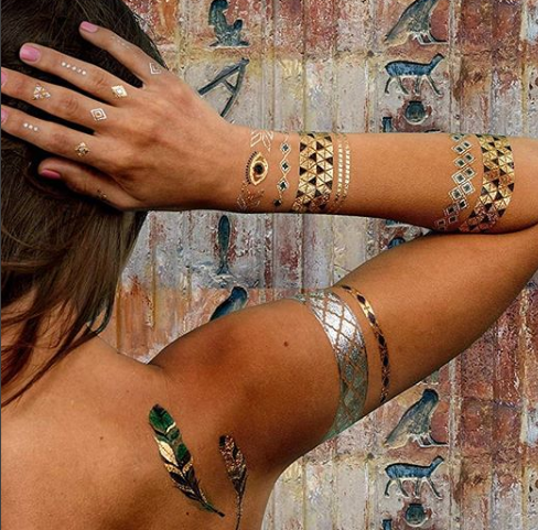 A woman with a feather tattoo on her back