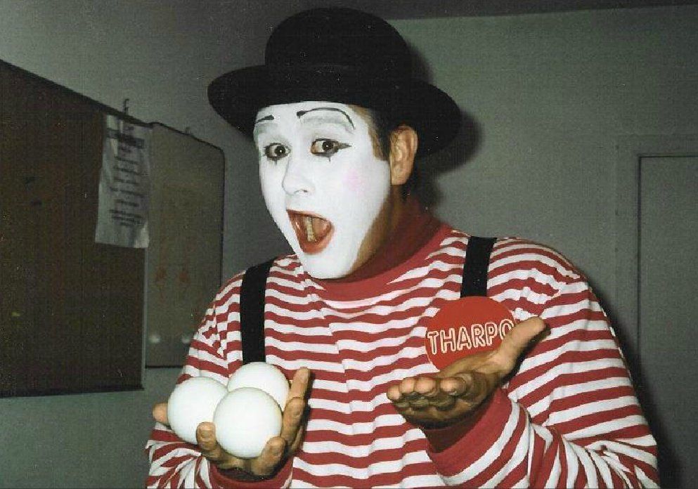 A mime is holding three eggs in his hands