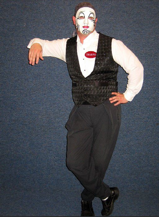 A man with face paint and a name tag that says rick