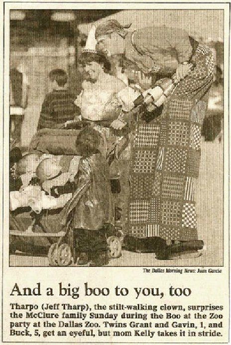 A black and white photo of a woman pushing a stroller with the caption 