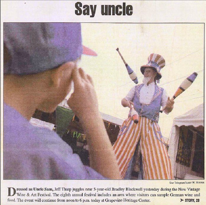 A newspaper article titled say uncle shows a juggler on stilts