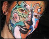 A close up of a person with their face painted.