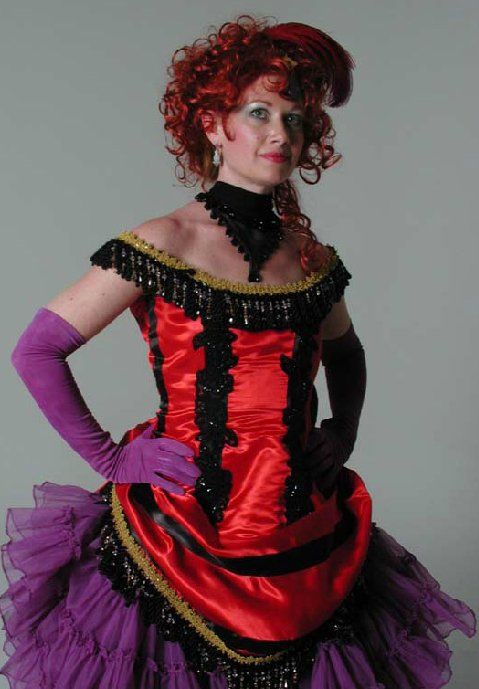 A woman in a red and purple dress with purple gloves