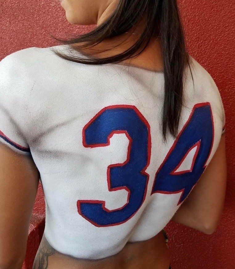 A woman with the number 34 painted on her back