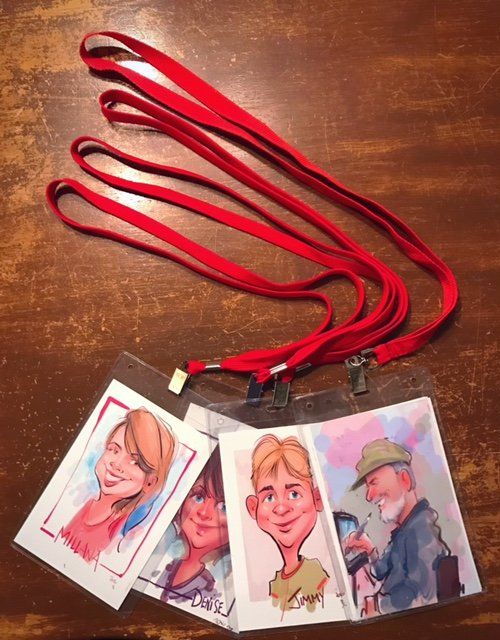 A bunch of lanyards with pictures of people on them
