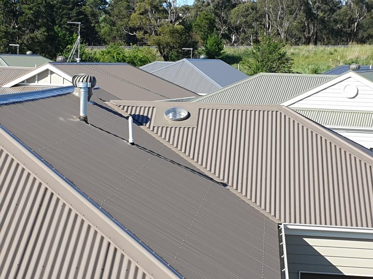 The Roof Of A House Has A Chimney And Skylight On It — The Woolmen In Murwillumbah, NSW