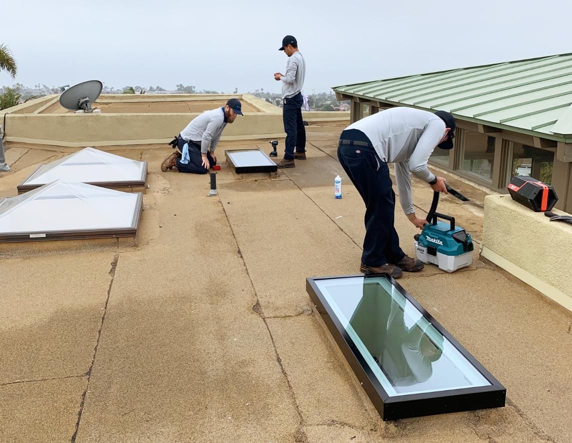 Three Men Are Working On The Roof Of A Building — The Woolmen In Casino, NSW