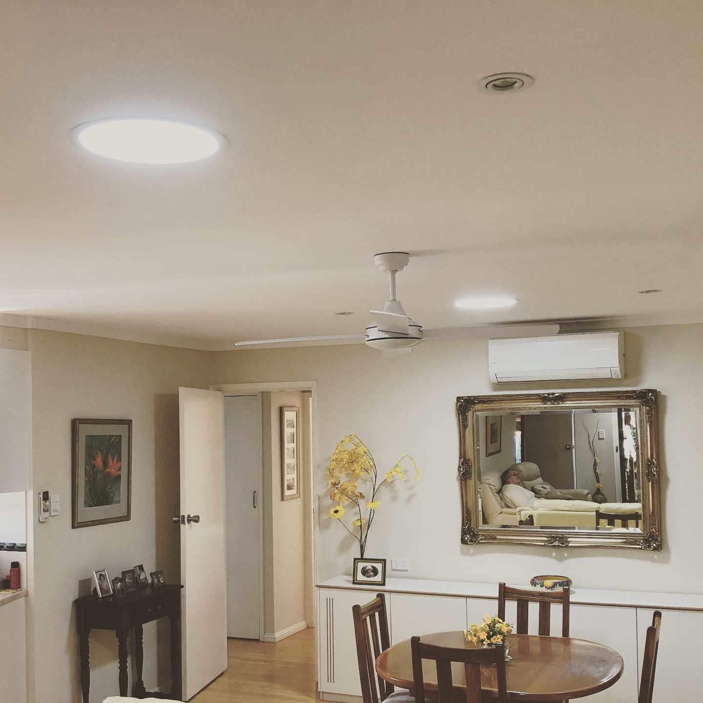 A Living Room With A Table And Chairs And A Mirror — The Woolmen In Alstonville, NSW