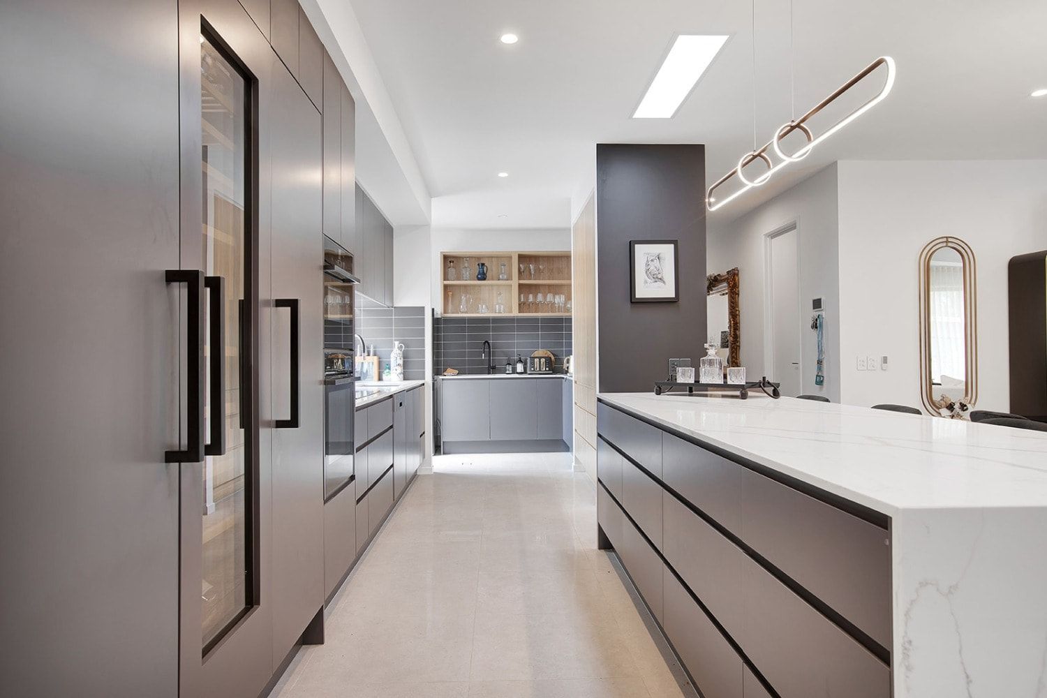 A Kitchen With A Large Island And Stainless Steel Appliances — The Woolmen In Alstonville, NSW