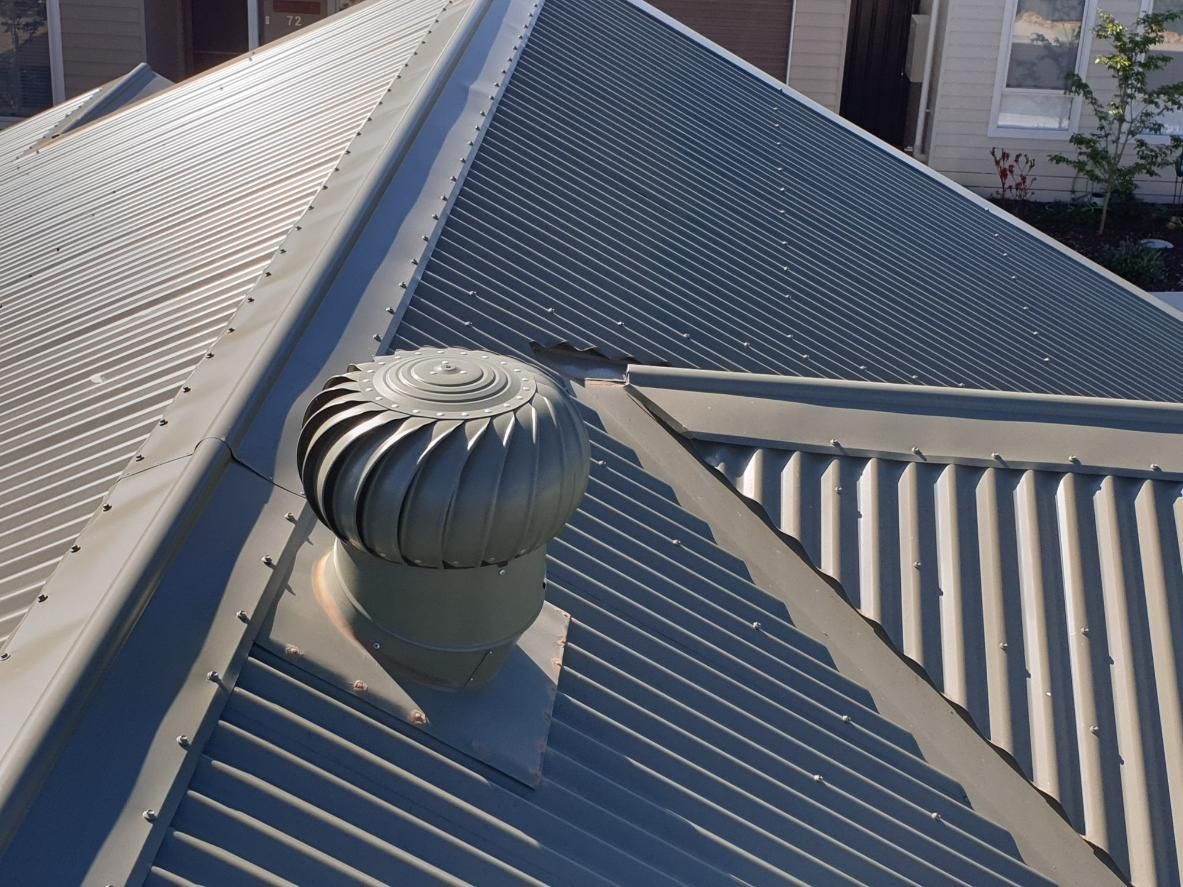 A Roof With A Spiral Shaped Vent On It — The Woolmen In Alstonville, NSW
