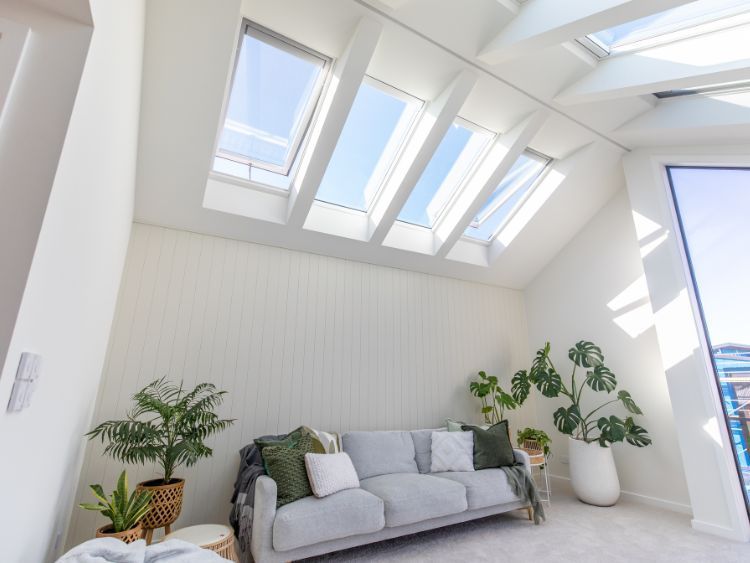 A Living Room With A Couch And Skylights On The Ceiling — The Woolmen In Byron Bay, NSW
