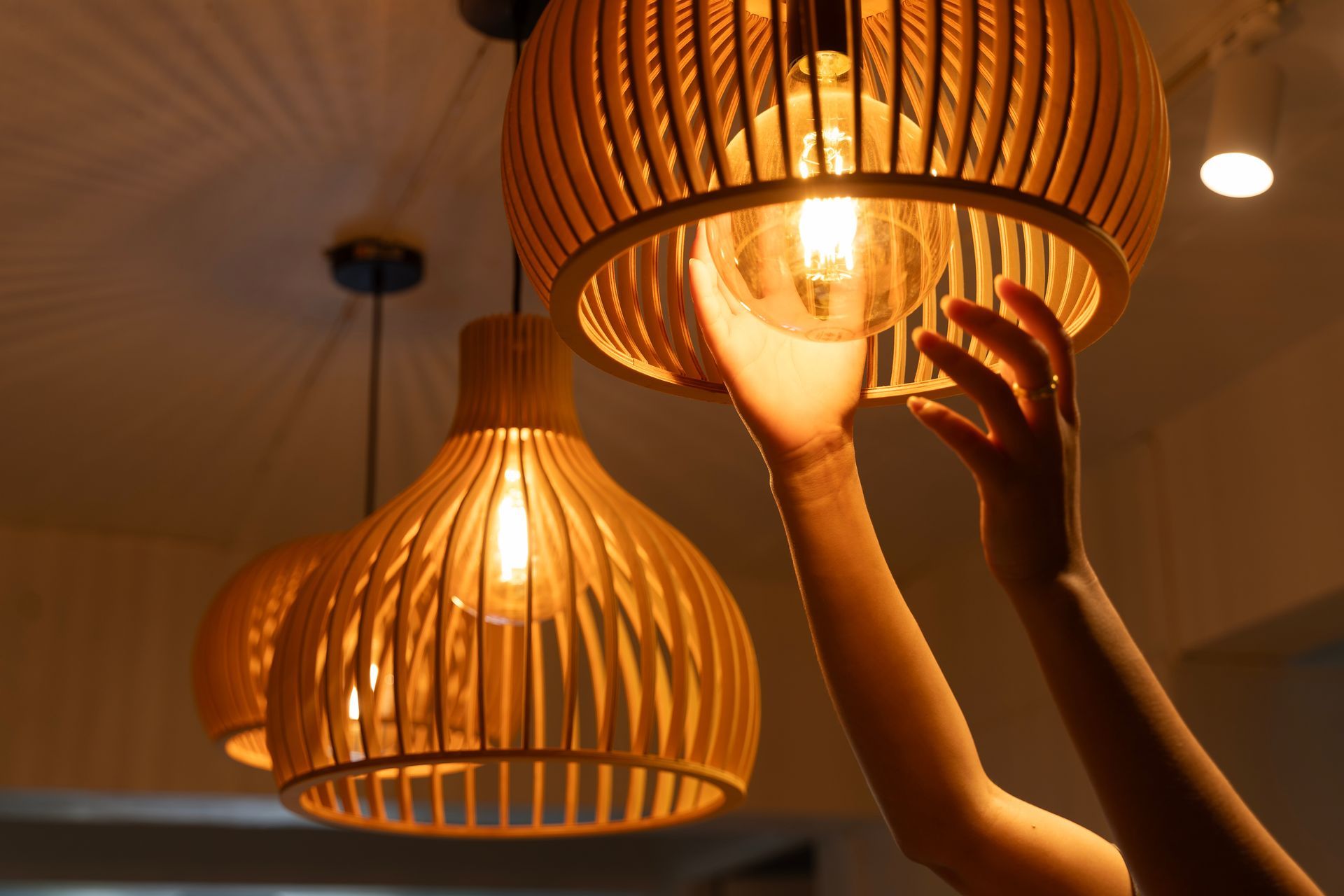 A bunch of tools are sitting on a wooden table.