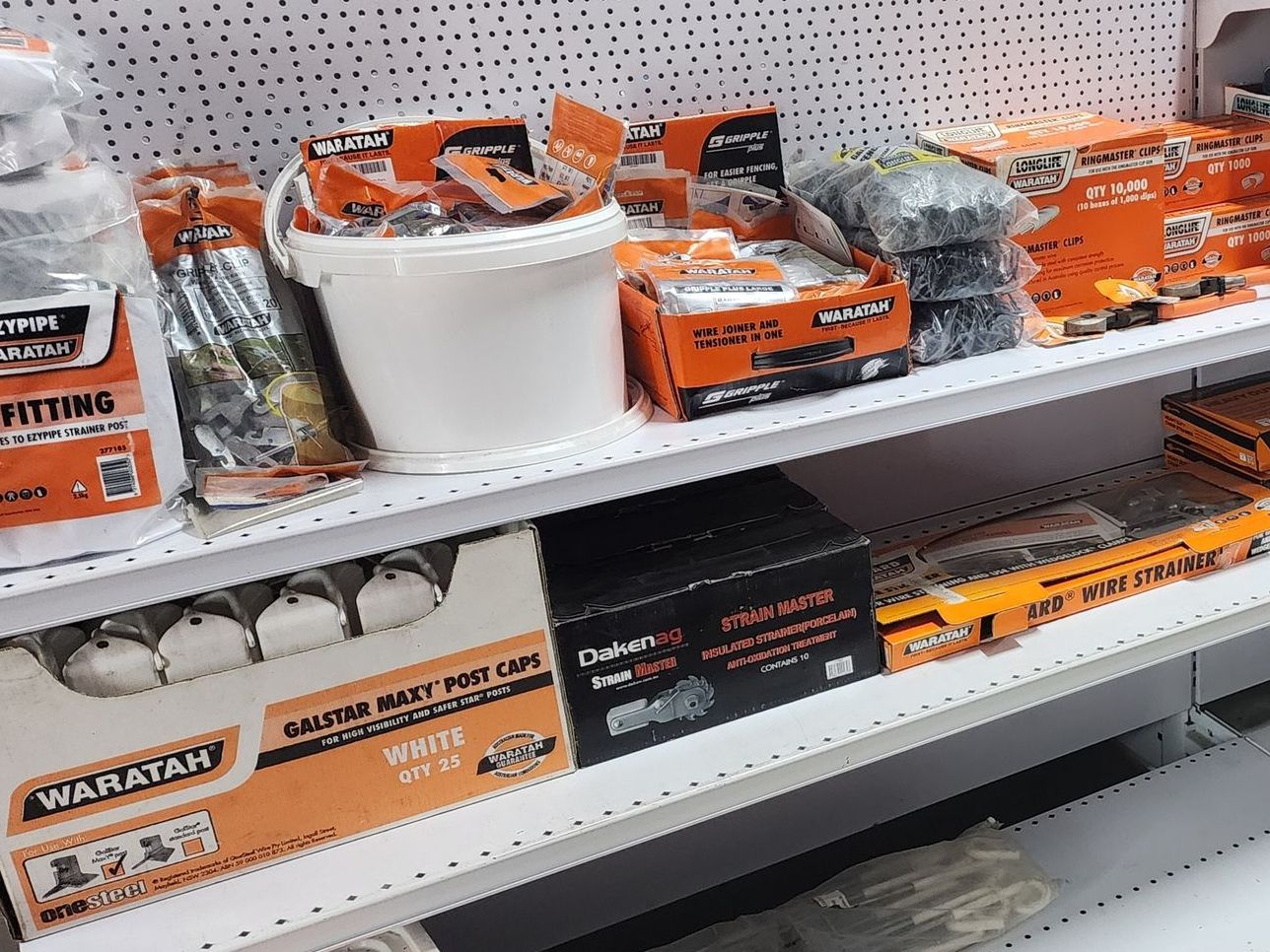 An aerial view of a fenced in area in a field.