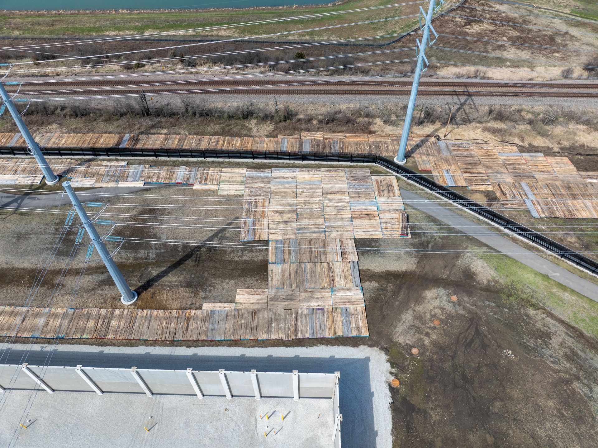Aerial view of a construction site for a concrete pad using heavy equipment.