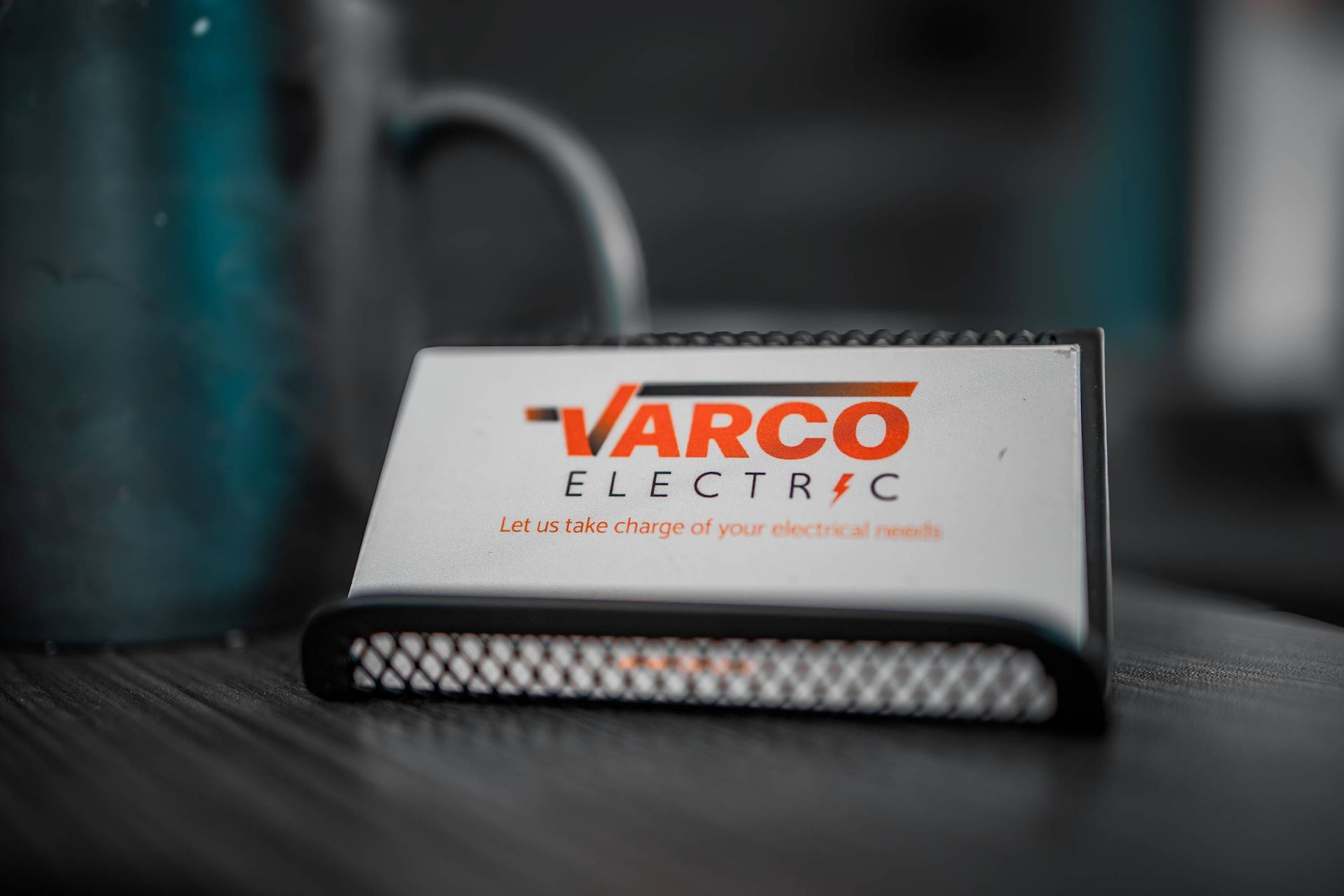 Business card for Varco Electric in a holder.