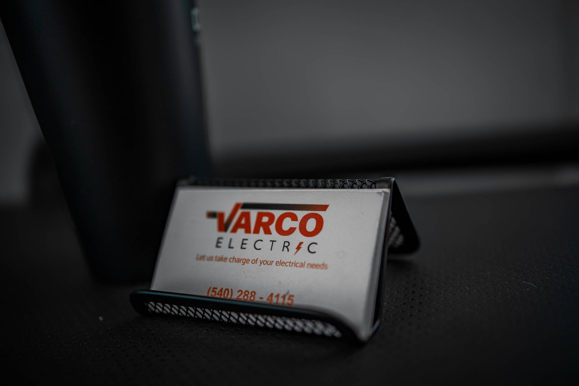 Business card for Varco Electric in a holder.