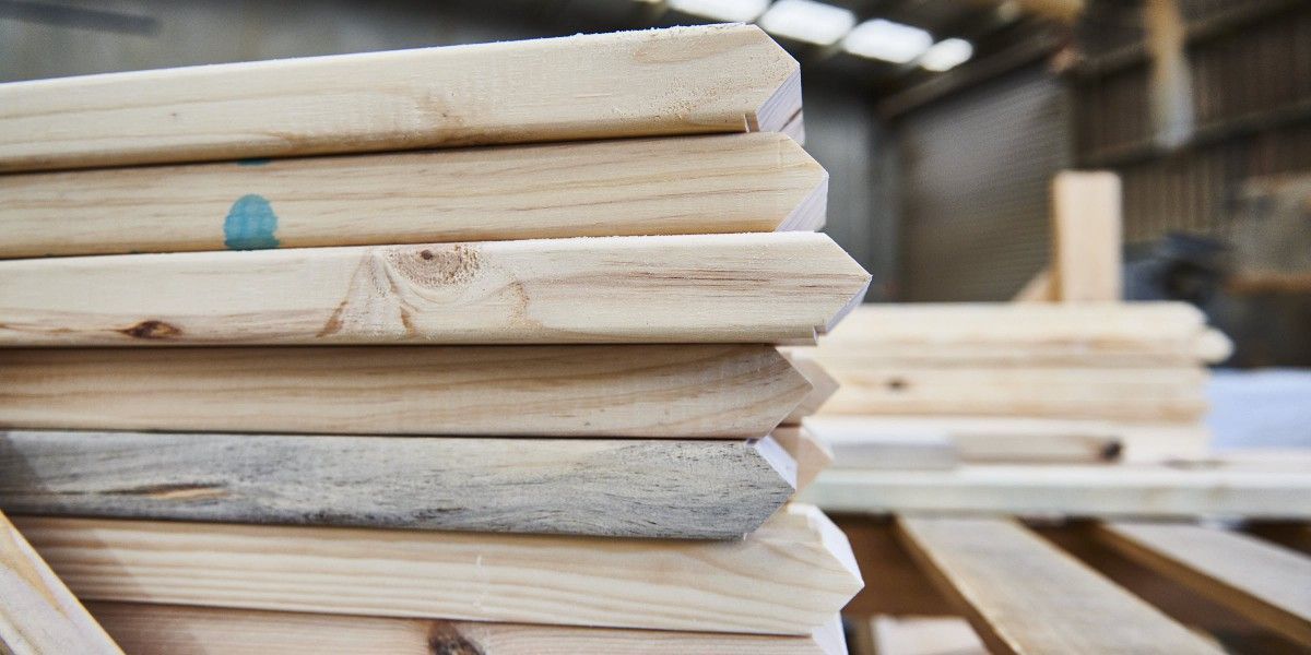 A stack of wooden boards sitting on top of each other on a table.