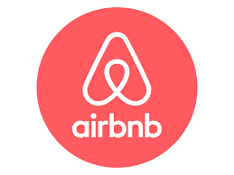Airbnb logo: white symbol inside a red circle, with