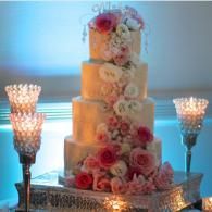 wedding cake with cascading pink and white flowers