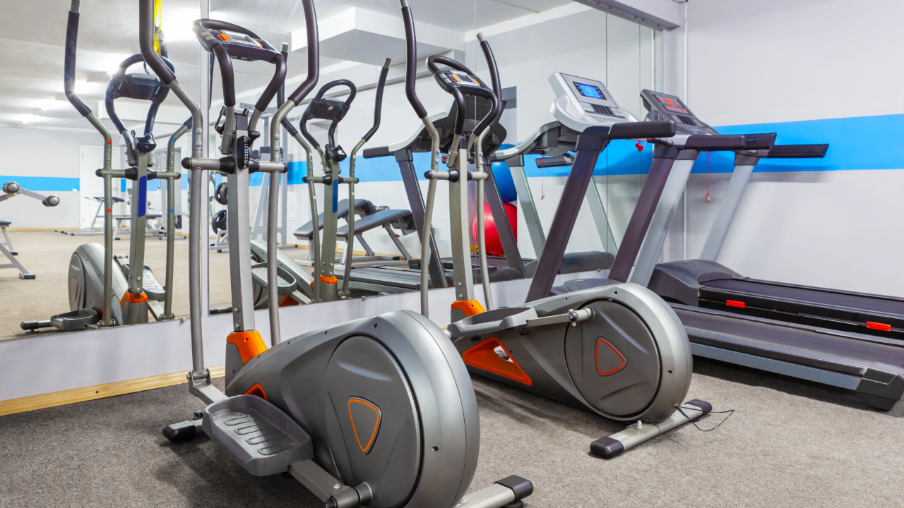 There are a lot of ellipticals and treadmills in the gym.