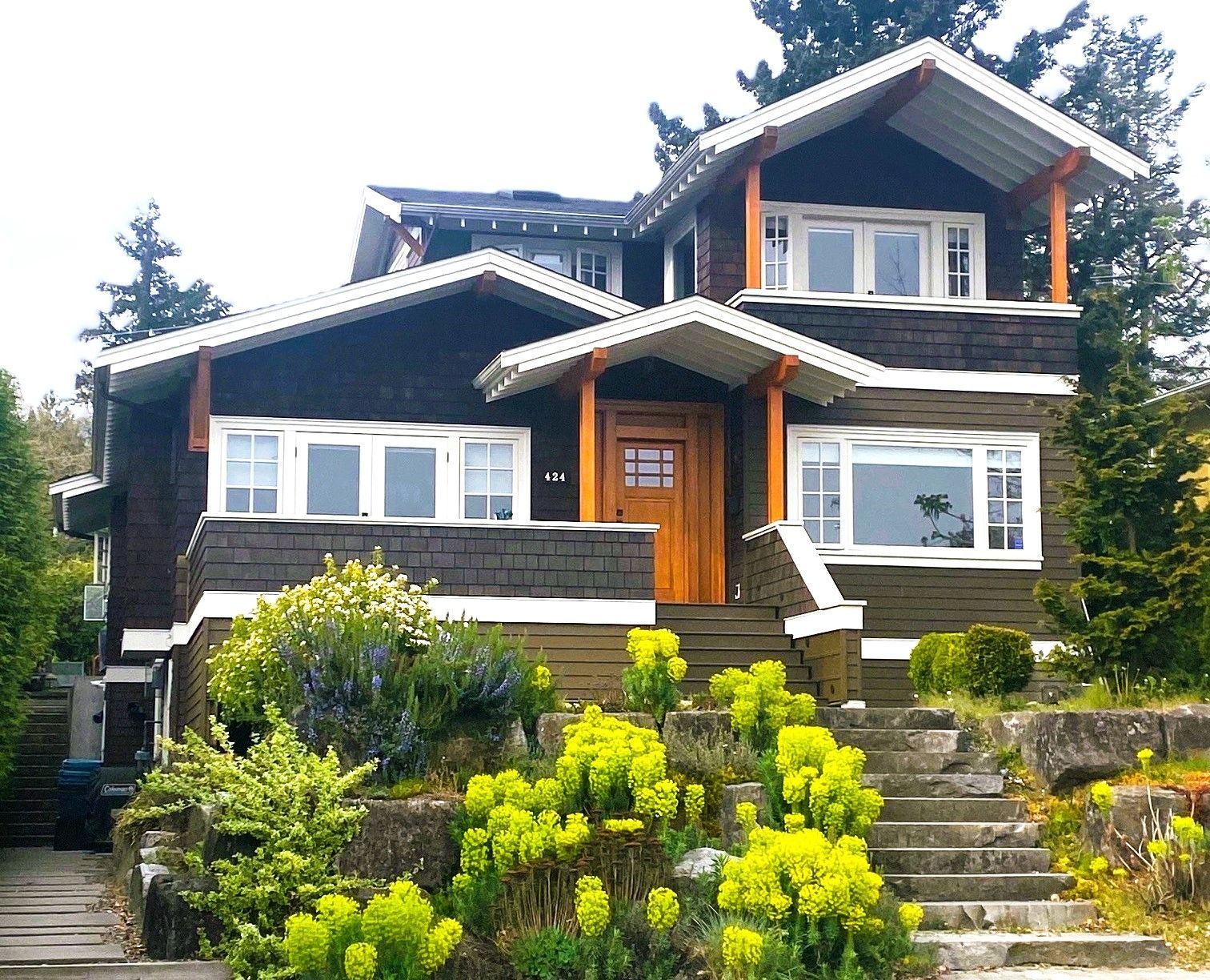 A large house with stairs leading up to it
