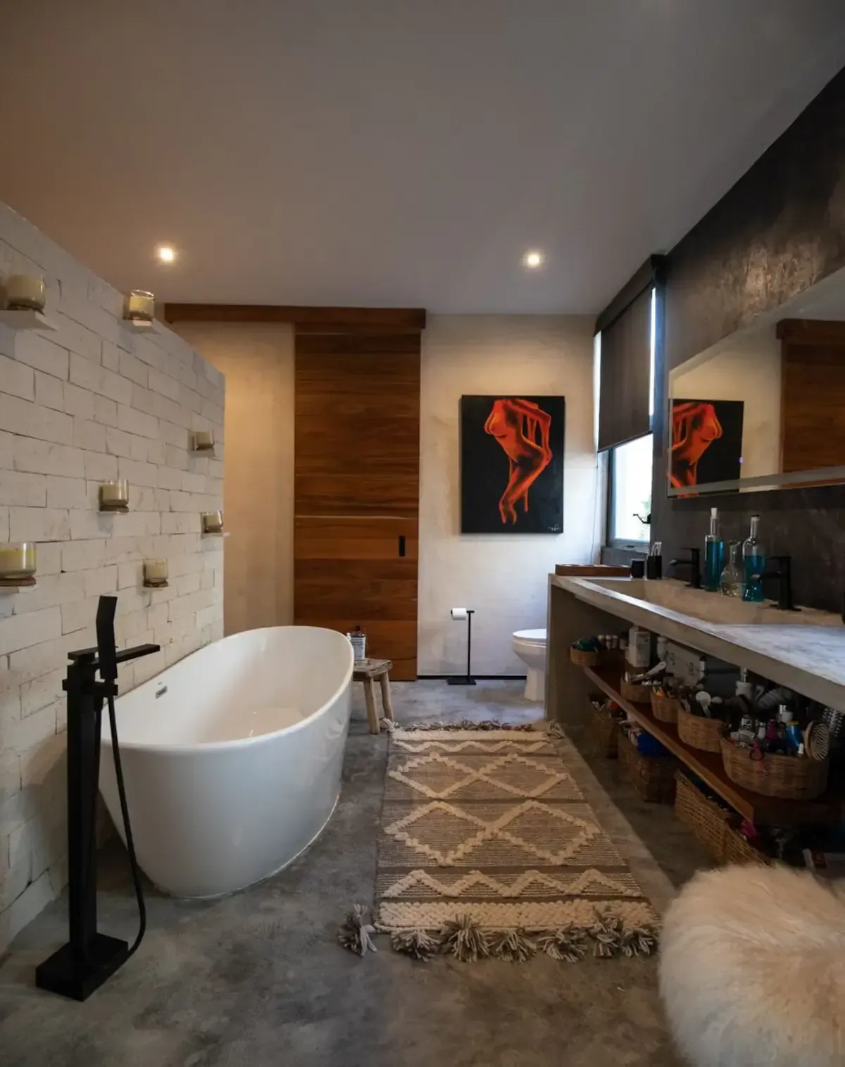 A bathroom with a bathtub and a sink