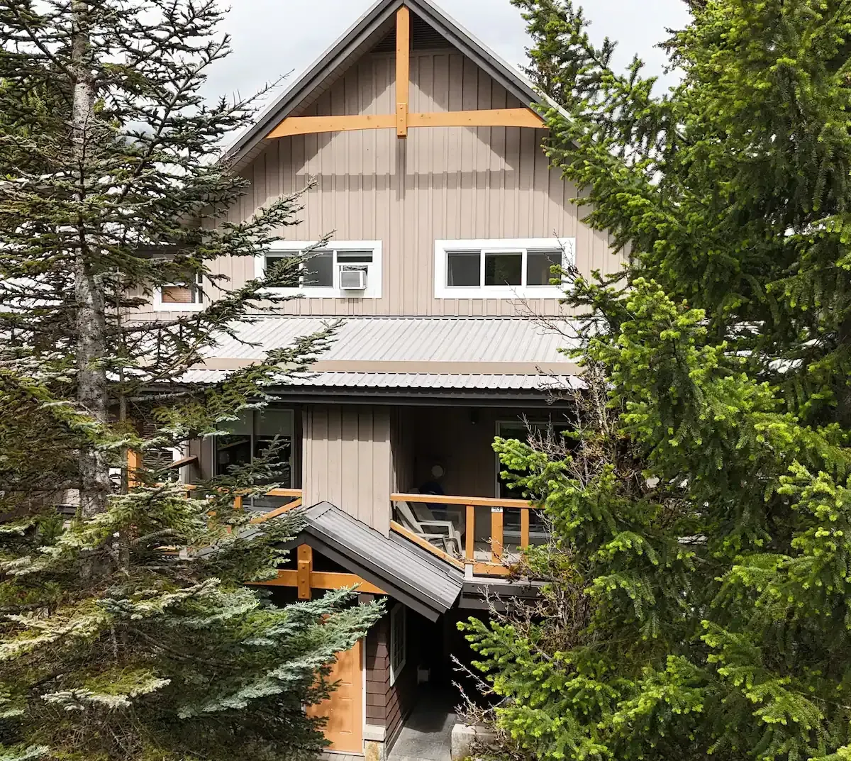 An aerial view of a house surrounded by trees