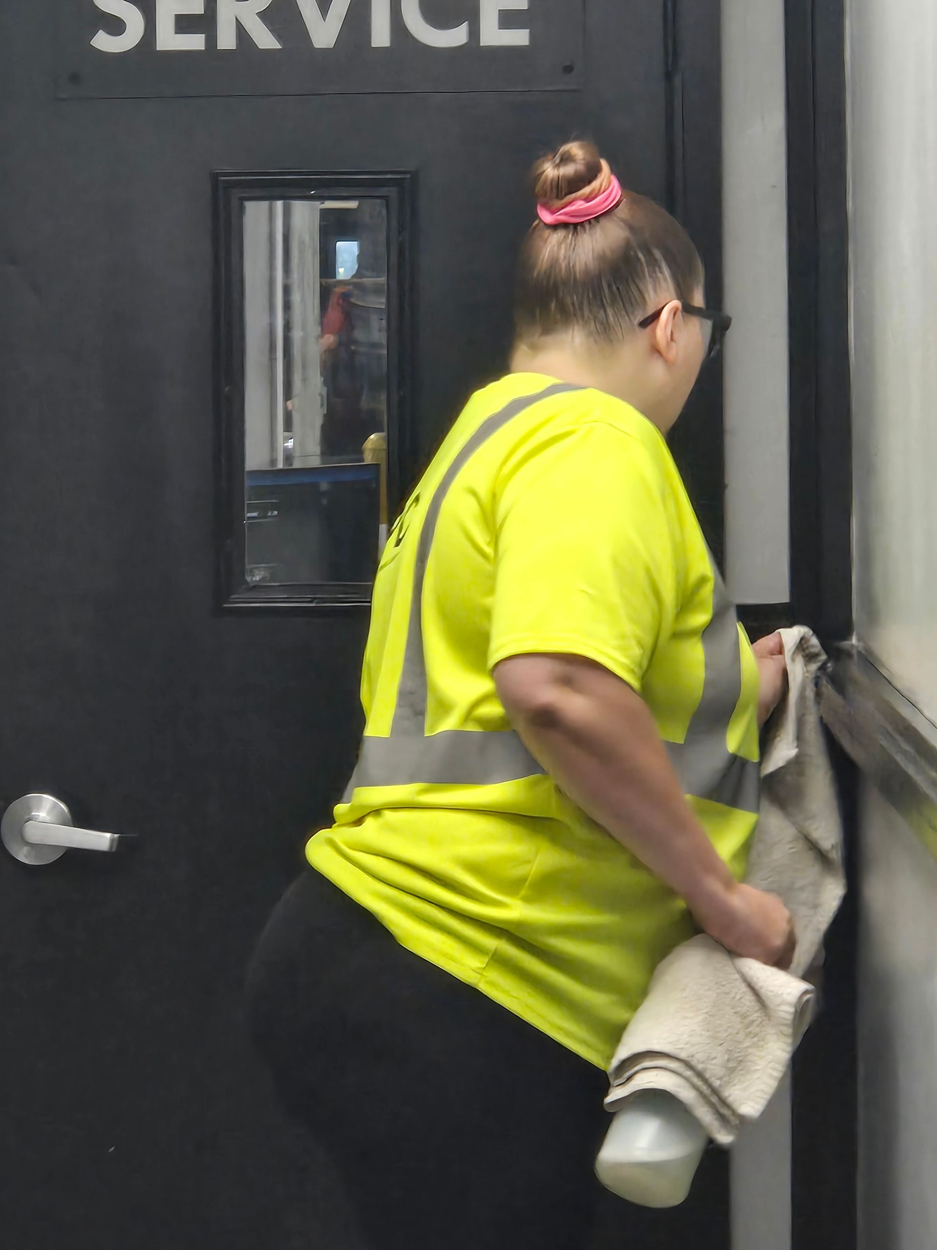 janitor cleaning door knob