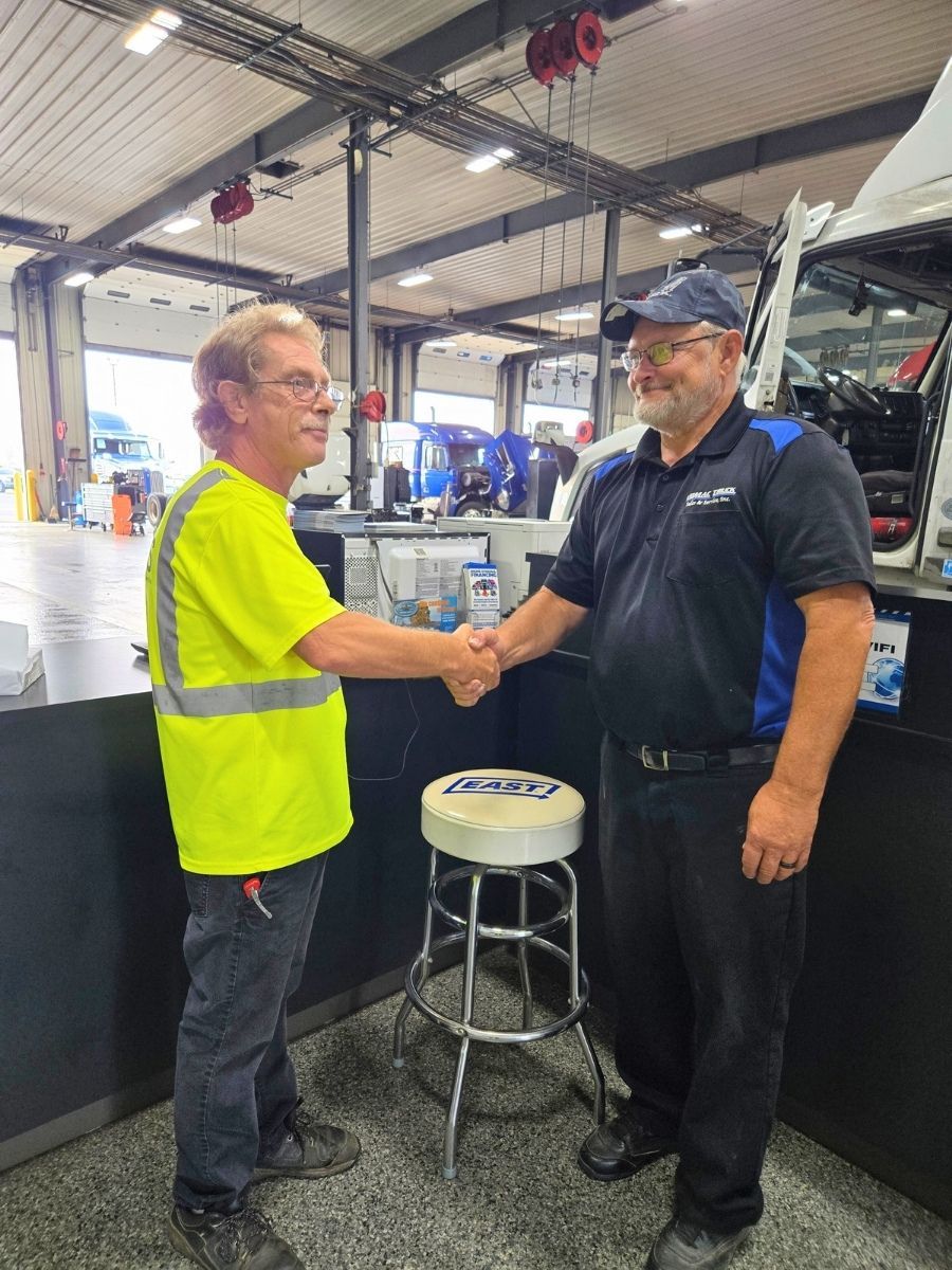 janitor shaking hands with customer