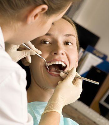 woman getting teeth cleaned