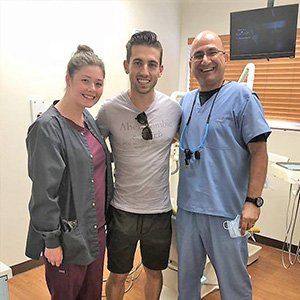 Dr. Haddad and Patient taking picture at Sewell Dental