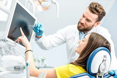 Doctor explaining Dental X-ray at Sewell Dental Designs