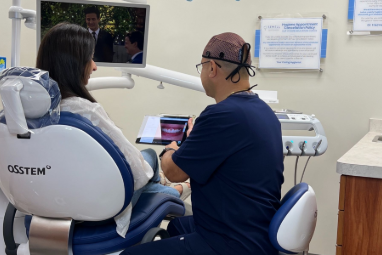 Woman with Jaw pain holding her face