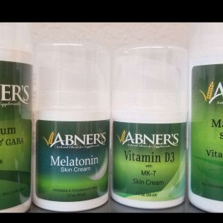 Four white and green Abner's skin cream bottles: GABA, Melatonin, Vitamin D3, and Vitamin K.