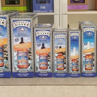 Boxes of Sovereign Silver Bio-Active Silver Hydrosol supplement on a shelf.