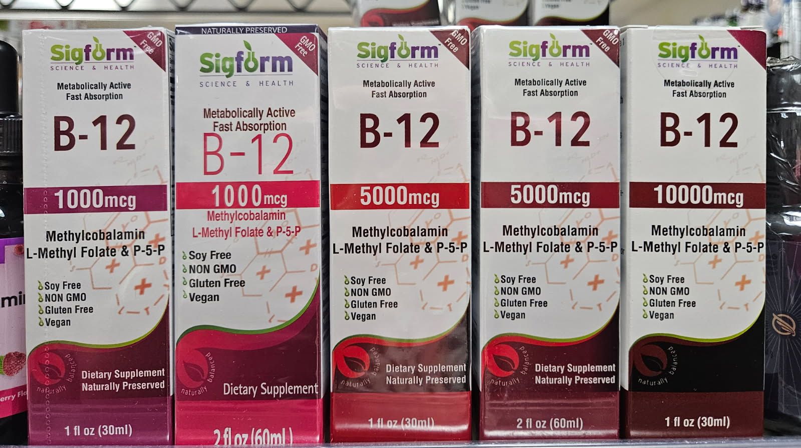 Five boxes of Sigform B-12 vitamin supplements, ranging from 1,000 mcg to 10,000 mcg.