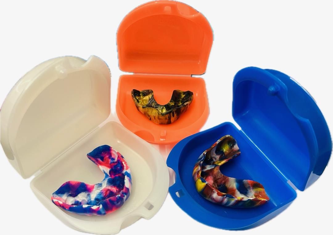 Woman Holding Mouthguard — Denture Care in Berserker, QLD