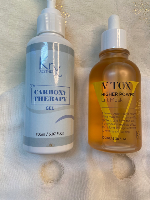 A bottle of vtox next to a bottle of carboxy therapy gel