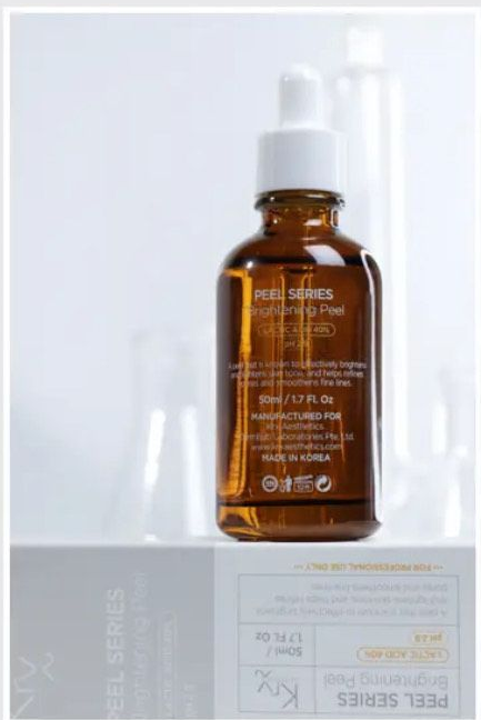 A woman is getting a facial treatment at a beauty salon.