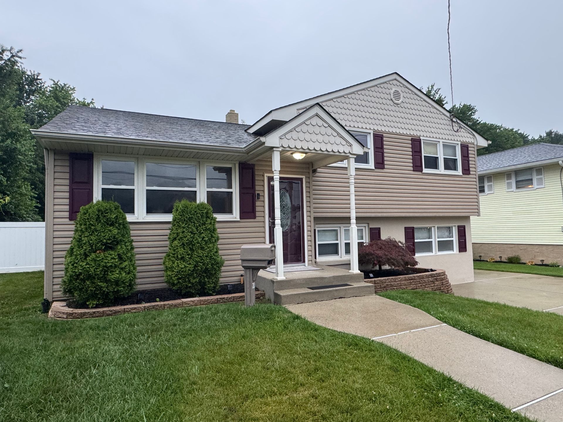 A row of houses on a sunny day with a blue sky in the background