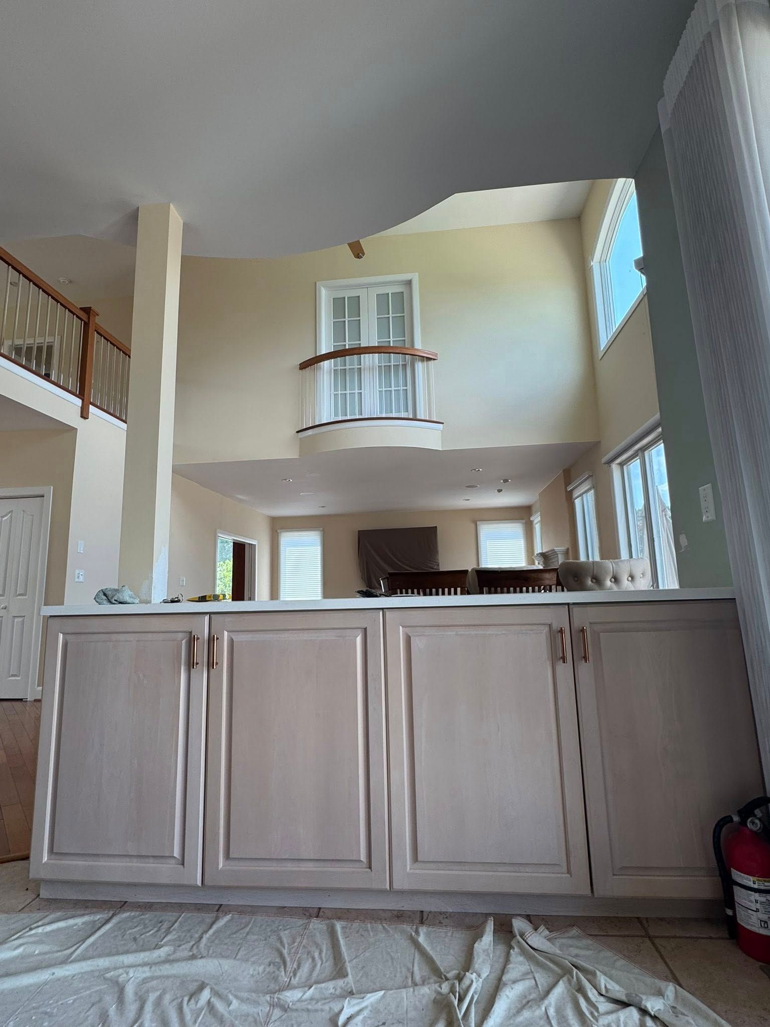 Three paint brushes are sitting on top of a color wheel.